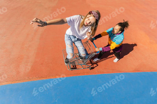 Preview: Multiracial group of young friends bonding outdoors
