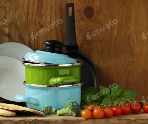 Preview: kitchen utensils pots and pans on the table