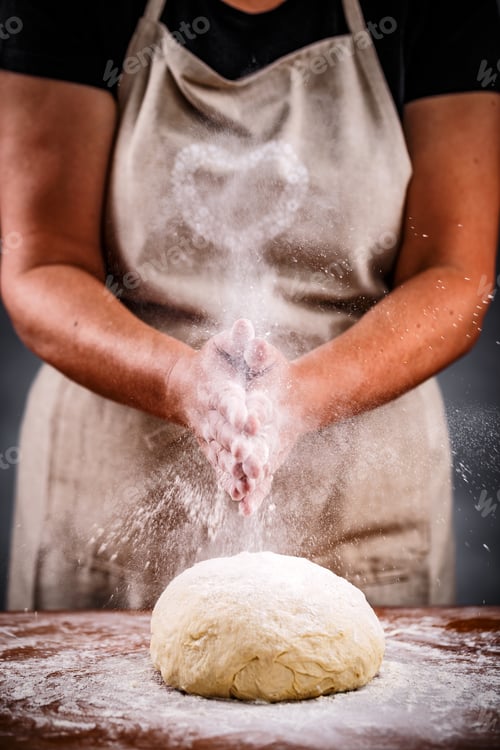 Preview: Woman sprinkling flour