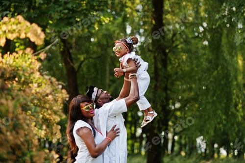 Preview: African american rich family having fun on sunset. Father throws daughter on his hands