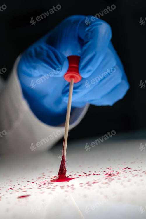 Preview: Forensic technician taking DNA sample from blood stain