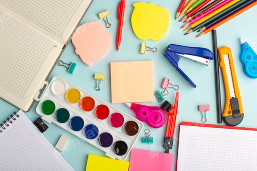 Preview: top view open copybook with colorful paints on ice blue desk drawing draw art color paint notepad