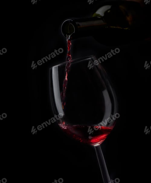 Red Wine Being Poured into a Glass