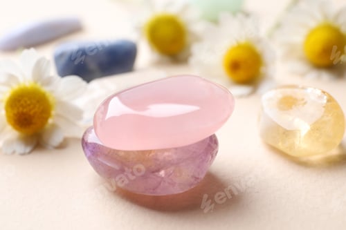 Preview: Beautiful gemstones on beige table, closeup. Healing crystals