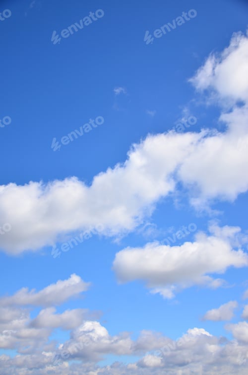 Preview: A photo of a bright and shiny blue sky with fluffy and dense white clouds