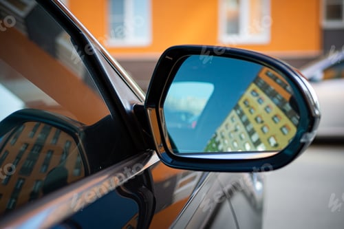 Preview: Anti-glare rearview mirror on a black car.
