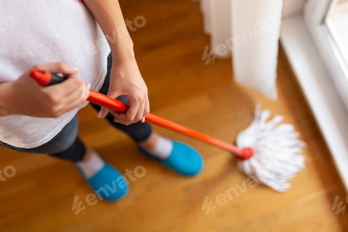 Preview: Woman wiping a floor