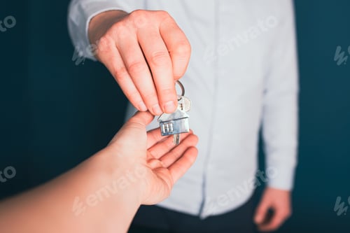 Preview: Female hand taking key from realtor buying renting new house, getting real estate ownership concept.
