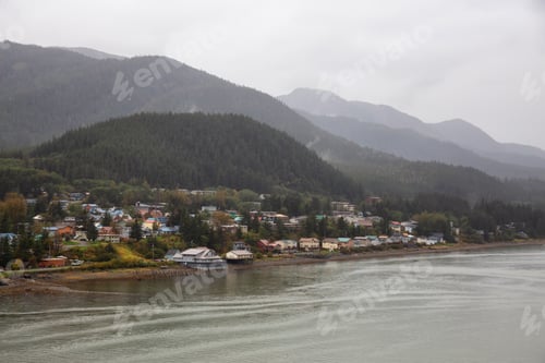 Preview: View of a small town, Juneau, during a cloudy morning with mountains in the background