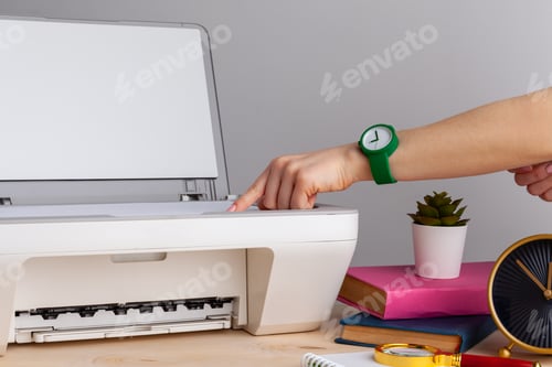 Preview: Close up of woman using a printer machine