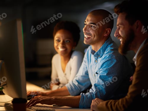 Preview: Cropped shot of a group of colleagues working late in an office