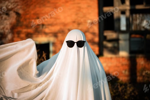 Aperçu: Celebrating halloween. Ghost Challenge 2021. Spooky trend season. A man in a ghost costume made from