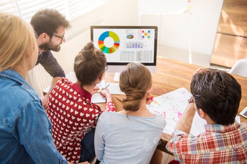 Preview: Workers looking at the monthly statistics