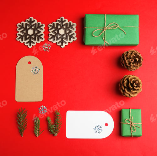 Preview: Frame made with Christmas decor on red background, flat lay. Space for text
