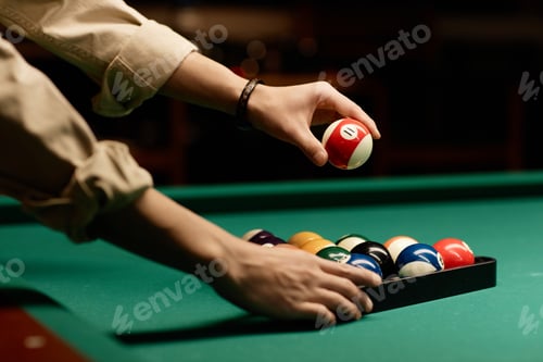 Preview: Male Hands Setting Up Billiard Balls on Pool Table
