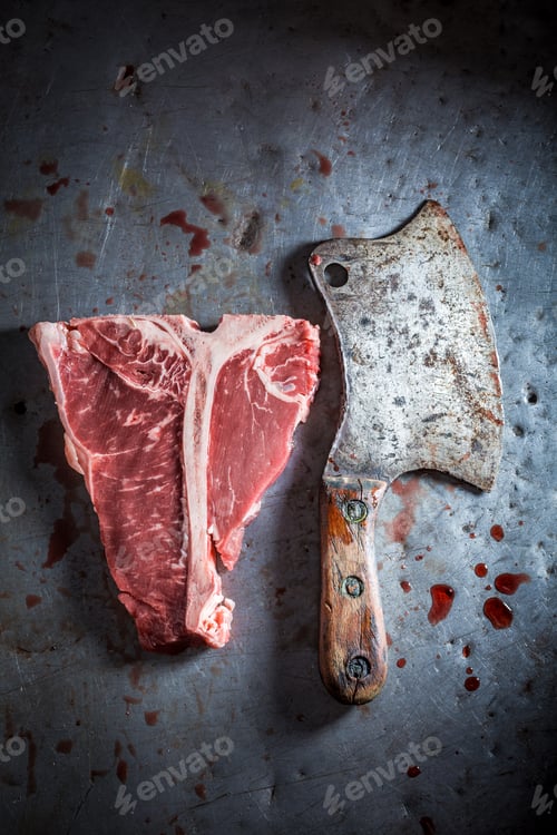 Preview: Fresh red steak on old metal table