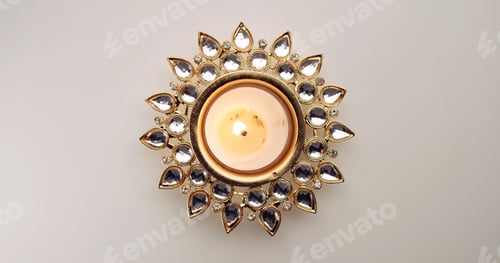 Preview: Top view of a burning decorative Diwali candle