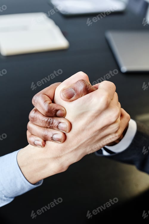 Preview: Business Partners Shaking Hands Top View