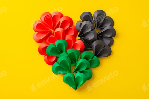 Preview: Overhead shot of miniature paper hearts arranged to create a grand heart shape