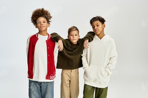 Preview: Stylish little boys share a moment of friendship and fun in vibrant attire