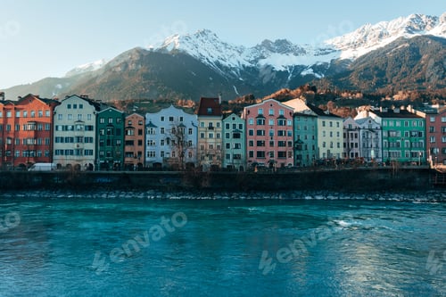 Preview: Colorful European buildings by the lake with a background of mountains