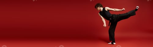 Preview: Curly-haired dancer expresses passion in a vibrant studio with red backdrop