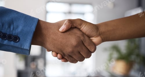 Preview: Closeup shot of two unrecognisable businesspeople shaking hands in an office