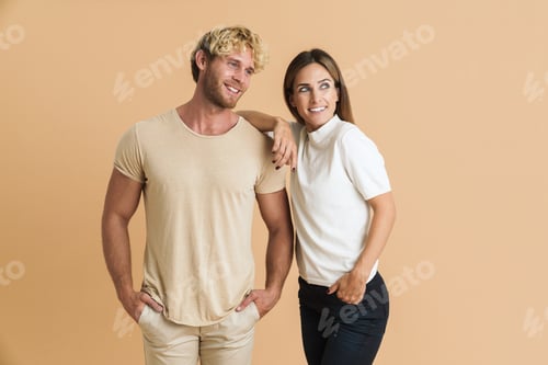 Preview: White couple wearing t-shirts posing and smiling at camera