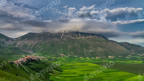 Preview: Cloudy sunset in the mountains over Castelluccio, Italy