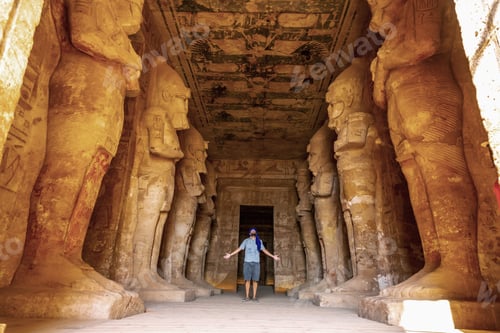 Preview: A young tourist looking at the pharaohs at the Abu Simbel Temple in southern Egypt