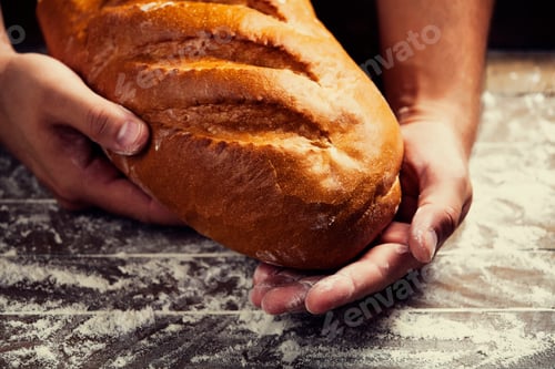 Preview: Baker's hands with a bread
