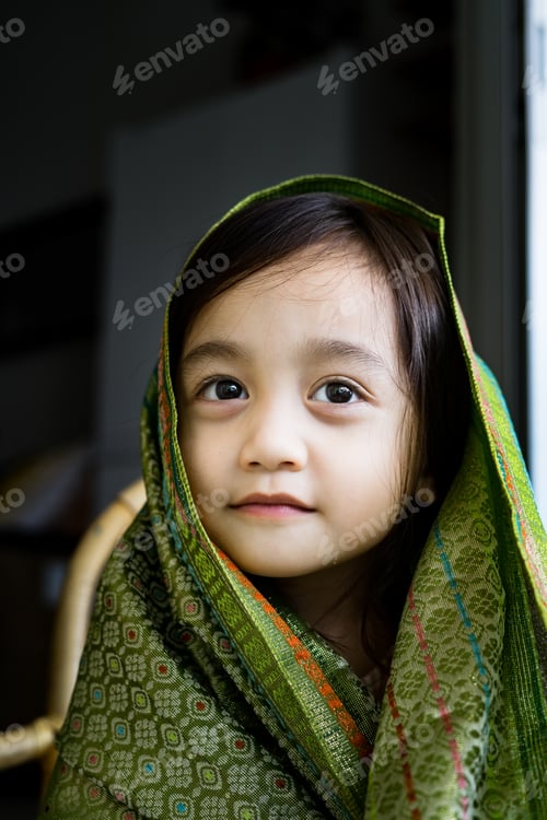 Preview: Portrait little asian girl wearing traditional Malaysia, Thailand, Indonesian Songket, shawl.