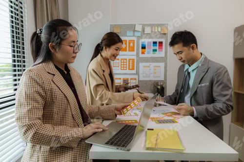 Preview: Digital product designers exchange ideas in their offices about how to design a website that meets t