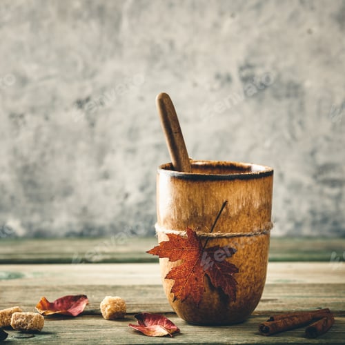 Preview: Cup of tea or coffee with autumn leaf