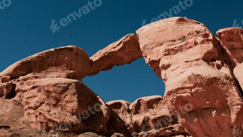 Preview: Natural rock arch formation in Wadi Rum Desert, showcasing stunning geological features