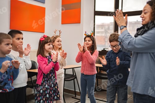 Preview: Teacher and elementary students at language school class