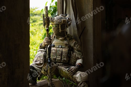 Preview: Special forces soldier in camouflage, Take refuge in an abandoned building