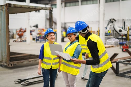 Preview: Multiracial engineers working inside robotic factory - Focus on african man hat