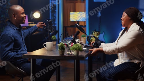 Preview: Man invited to podcast entering studio with host, ready to participate in entertaining discussion
