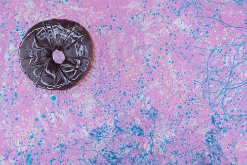 Preview: Chocolate doughnut bun on a textured background