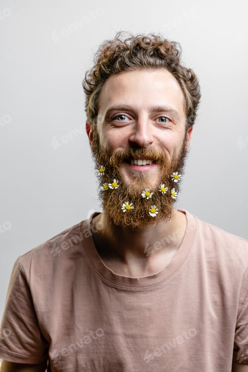Preview: Satisfied cheerful handsome man smiles at camera isolated over white background.