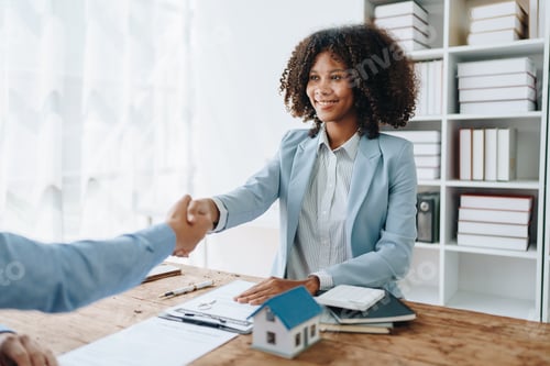 Preview: The bank's Female African american Mortgage Officers shake hands with customers