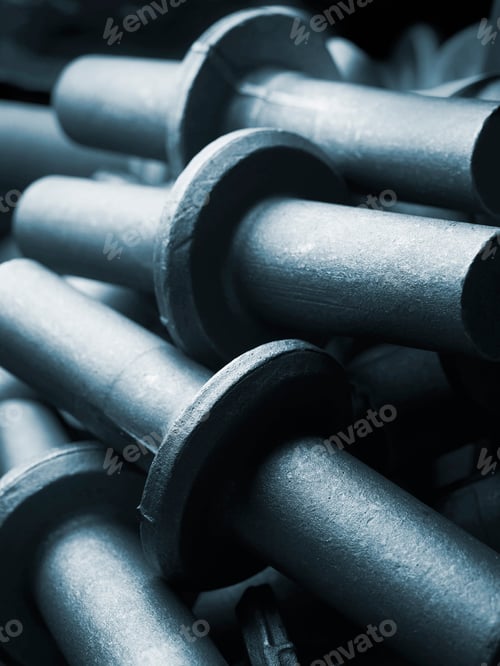 Preview: Closeup of an array of industrial pipes in monochrome tones
