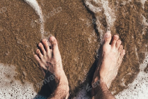 Preview: Legs in the sea waves Sea beach Sea waves overlook the sandy shore