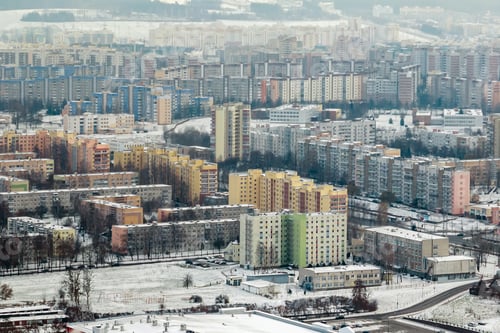 Preview: winter panoramic aerial view of a huge residential complex with high-rise buildings with snow