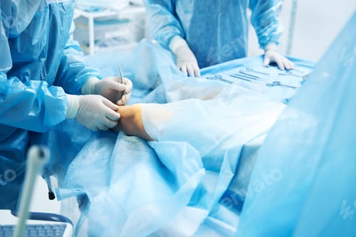 Preview: Hands of professional doctor holding surgical tool