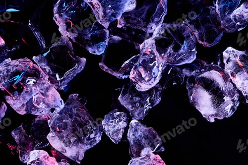 Preview: top view of transparent ice cubes with purple illumination isolated on black