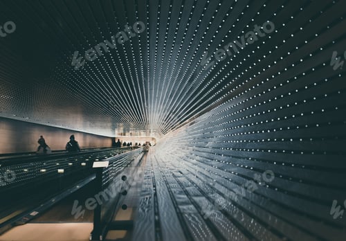 Preview: Art installation - people moving on a walking escalator through a tunnel of LED lights.