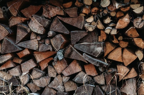Preview: A large stack of firewood for the winter at outdoor. Rustic lifestyle background.