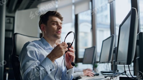 Preview: Support agent take headset talking client. Professional assistant work in office